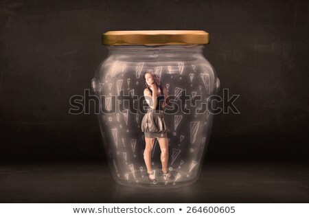 Imagine de stoc: Business Woman Trapped In Jar With Exclamation Marks Concept