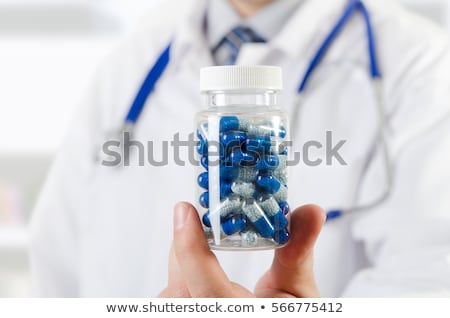 Stockfoto: Doctor Scientist Invented New Drug Holds Capsule In Hands