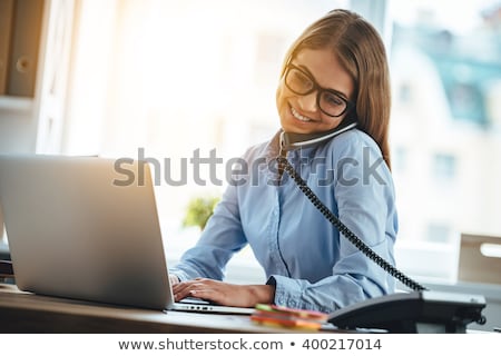 Foto stock: Businesswoman Phoning In The Office