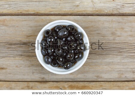 Zdjęcia stock: Bowl Of Black Olives With Herbs