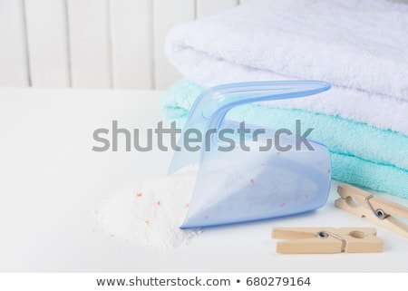 Stock fotó: Bath Towels Washing Powder In Measuring Cup And Wooden Clothesp