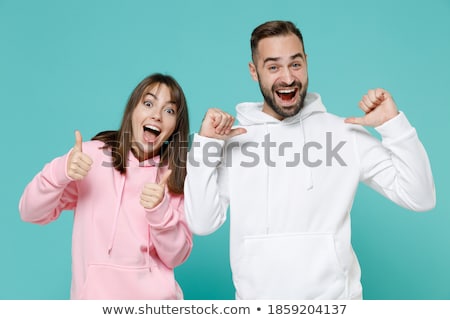 Stock fotó: Portrait Of An Excited Young Woman Wearing Hoodie