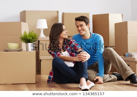 Сток-фото: Couple With Boxes And Lamp Moving To New Home