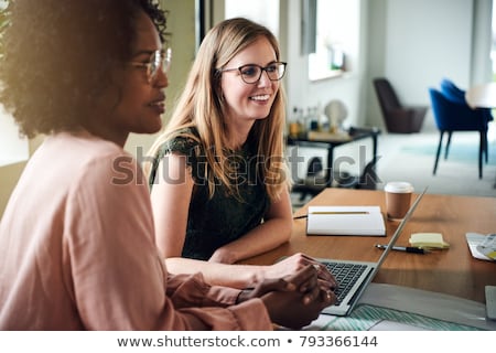 Stock photo: Woman Working On Two Laptops