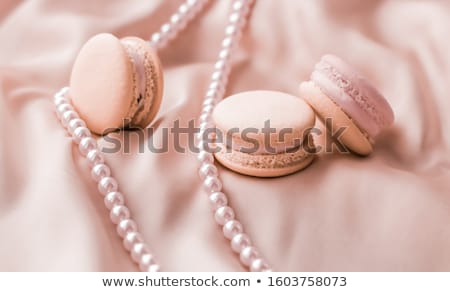 Stock foto: Sweet Macaroons And Pearls Jewellery On Silk Background Parisia