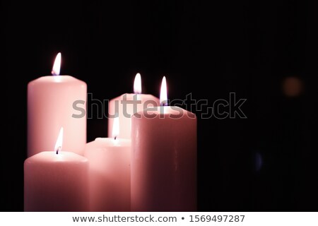 Foto stock: Aromatic Pink Floral Candles Set At Night Christmas New Years