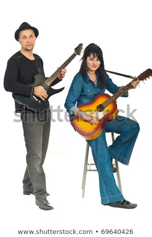 [[stock_photo]]: Two Sitting Men In Hats Play On Guitars