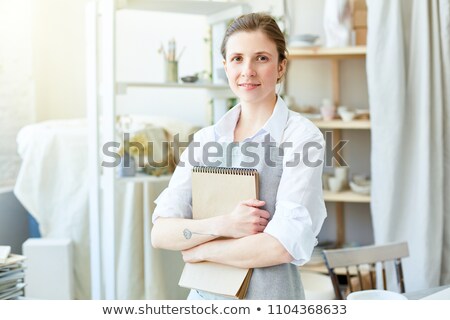 Craftswoman Holding A Notepad Stock photo © Pressmaster