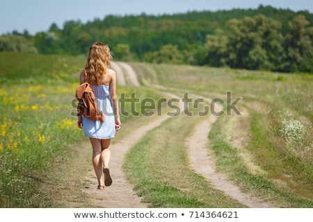 Stock fotó: Beautiful Woman Wearing Blue Dress On A Field