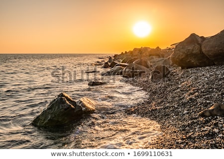 Stok fotoğraf: Rocky Shore At Sunset