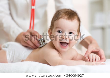 Stok fotoğraf: Pediatrician Check Child Back With Stethoscope