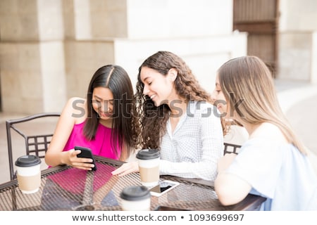 Stock photo: Group Of Teenage Girls Sitting At Outdoor Cafe