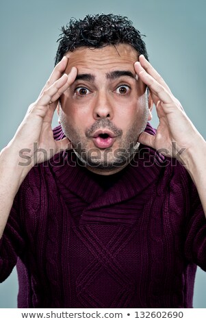 Foto stock: Man Fears To Shave Over Gray Background