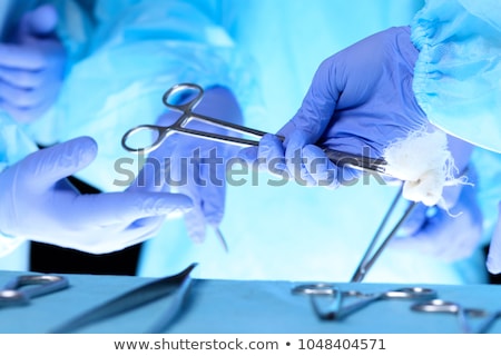 Stock fotó: Close Up Of Surgeon Hand Holding Surgical Tool In Operation Theater