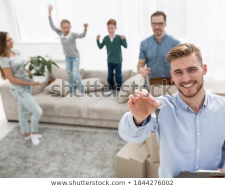 Foto stock: Realtor With Folder Showing Documents To Customers