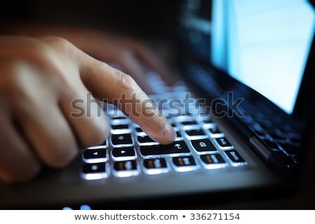 Сток-фото: Stressed Man At Computer Monitor At Night Office
