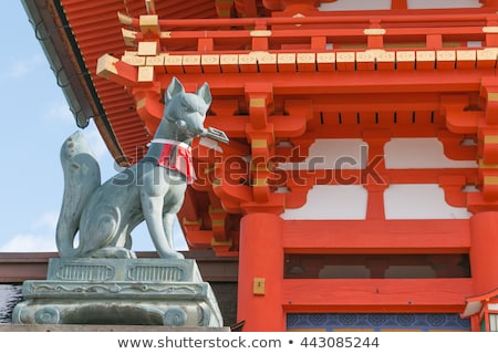 Stok fotoğraf: Fox In Front Of A Inari Shrine