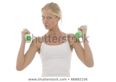 Stock photo: Portrait Of A Young Caucasian Woman Who Trains With Dumbbells In Hand