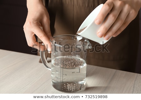 Foto stock: Chia Seeds In Measuring Cups
