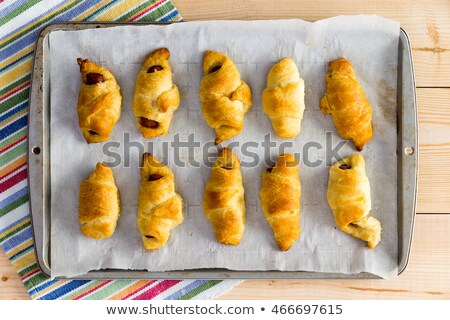 Foto stock: Freshly Baked Tray Of Hot Dog Croissants