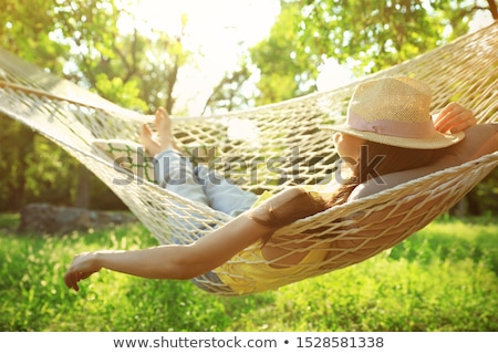 Foto stock: Sunny Sleeping In Hammock