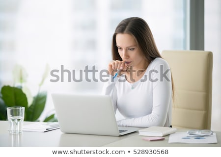 Foto stock: Depressed Female Executive Working On Computer