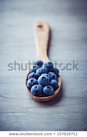 Сток-фото: Berries And Vintage Spoon On A Blue Background