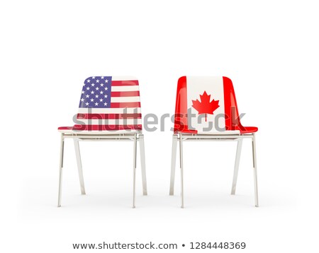 Foto stock: Two Chairs With Flags Of Canada And Us Isolated On White