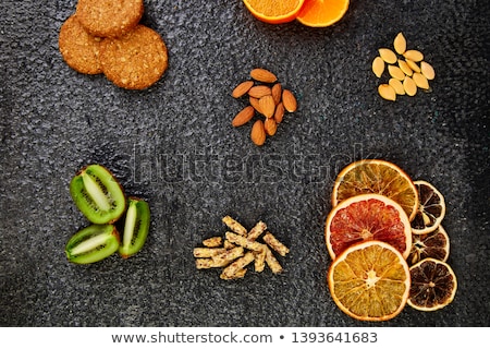 [[stock_photo]]: Healthy Snacks - Variety Oat Granola Bar Rice Crips Almond Kiwi Dried Orange