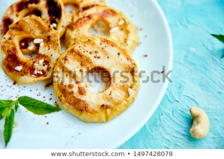 Stock photo: Grilled Apples With Cinamon On White Plate On Blue Background