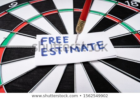 Stock fotó: Free Estimate Text At The Center Of Dartboard