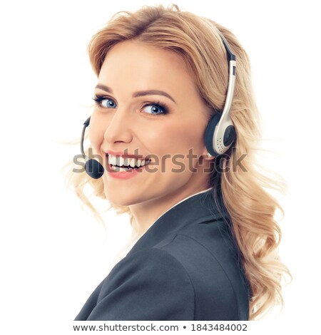 Foto d'archivio: Happy Young Operator In Headphone Consulting Clients Online In Isolation
