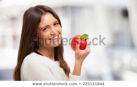 Foto d'archivio: Woman Holding Apple With Bright Smile