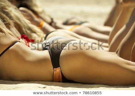 Stock foto: Pretty Girl Suntanning At The Beach
