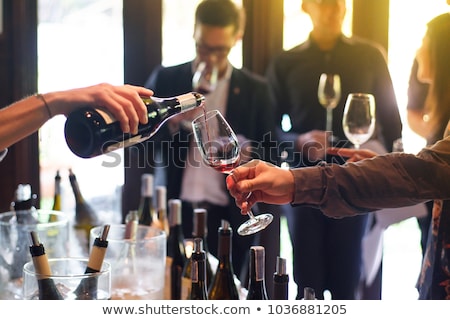 Foto stock: Woman Tasting Wine In A Winery