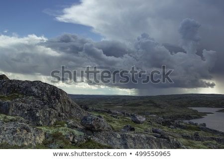 Stok fotoğraf: Majestic Stormy Cloud And Sun Beams Over A Lake In The Mountains