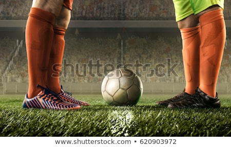 Stok fotoğraf: Football Players Playing Soccer In The Ground