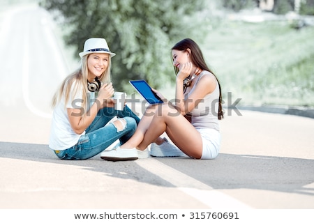 Stock photo: Hitchhiking On The Internet With Coffee Girls And Music