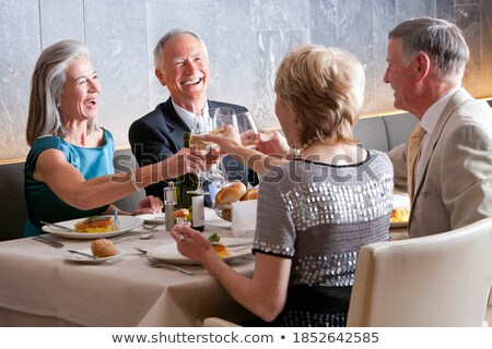 Zdjęcia stock: Couple Toasting Wine Glasses While Holding In Restaurant