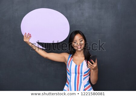 Foto stock: Image Of Charming Asian Woman 30s Holding Blank Thought Bubble A