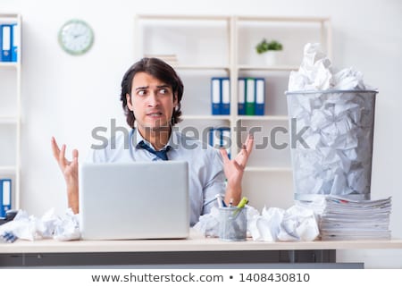 Foto stock: The Businessman Rejecting New Ideas With Lots Of Papers