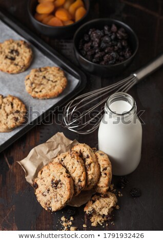 Сток-фото: Homemade Organic Oatmeal Cookies With Raisins In Baking Tray On Grey Wooden Background