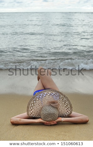 Stock fotó: Young Woman Sun Bathing On A Sandy Beach Of Thailand