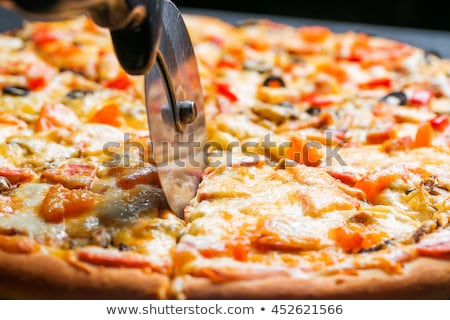 Zdjęcia stock: Chef Knife Cuts Pizza Closeup