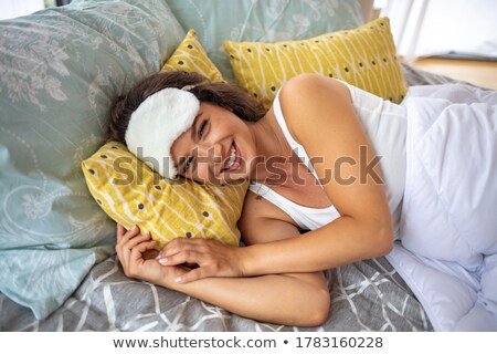 Stock fotó: Woman Lying At The End Of The Bed