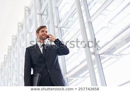 ストックフォト: いビジネスマンが携帯電話で話す