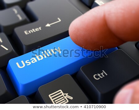 Stock photo: Finger Presses Blue Keyboard Button Usability