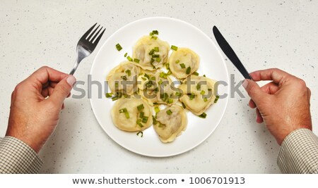 Foto stock: Meat Dumplings In Front Of Visitor