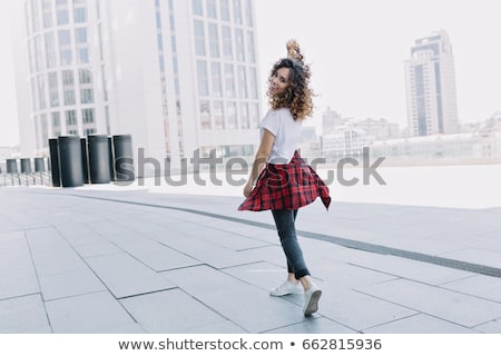 Stockfoto: Portrait Of A Happy Girl Dressed In Autumn Clothes