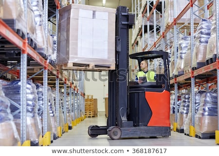 Foto stock: Loader Operating Forklift At Warehouse